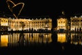 Bordeaux, France - SeptemberÃ¢â¬Å½ Ã¢â¬Å½15Ã¢â¬Å½, Ã¢â¬Å½2018 : Fire juggler draws a heart of fire at the water mirror in Bordeaux Royalty Free Stock Photo